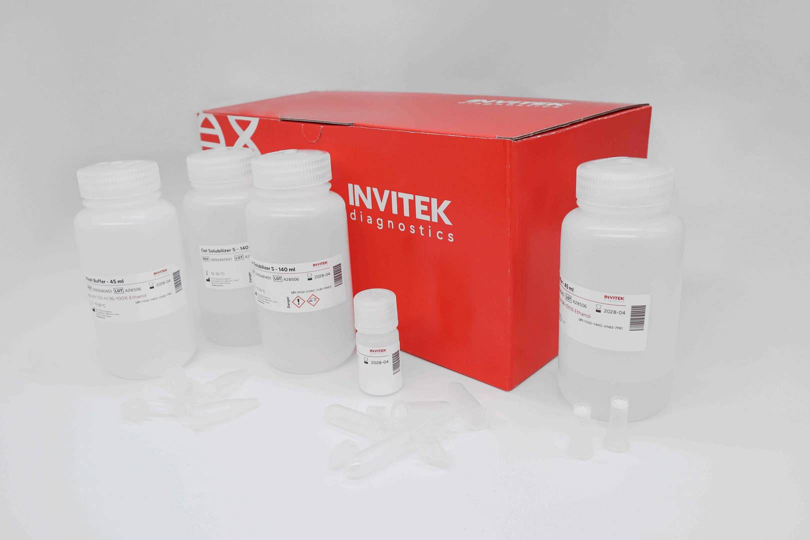 Red Invitek Diagnostics InviSorb Fragment CleanUp box with reagent bottles and spin filters on a lab bench.