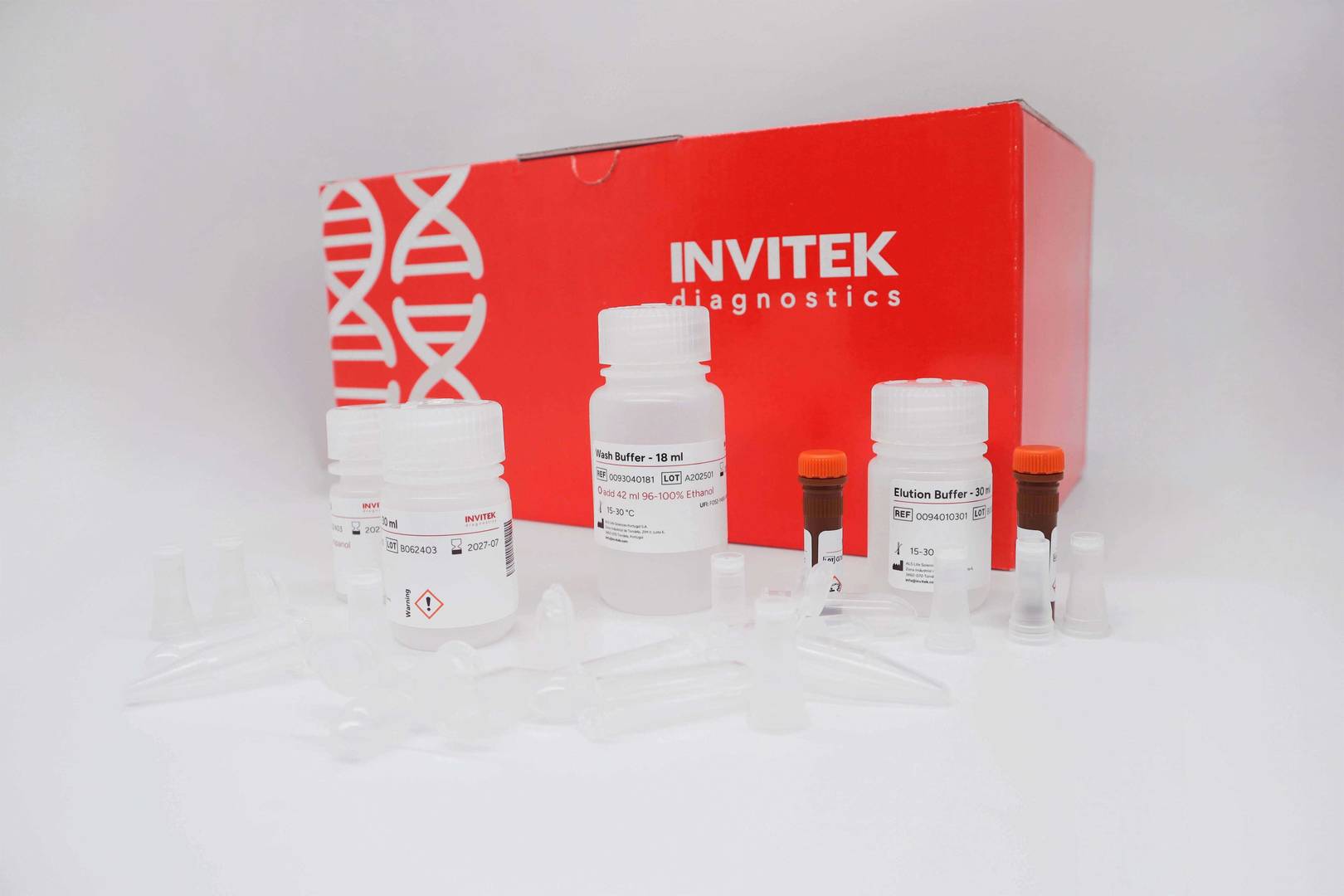 Red Invitek Diagnostics InviSorb Spin Tissue Kit box behind reagent bottles, and brown reagent vials with spin filters, and tubes laying scattered in front.