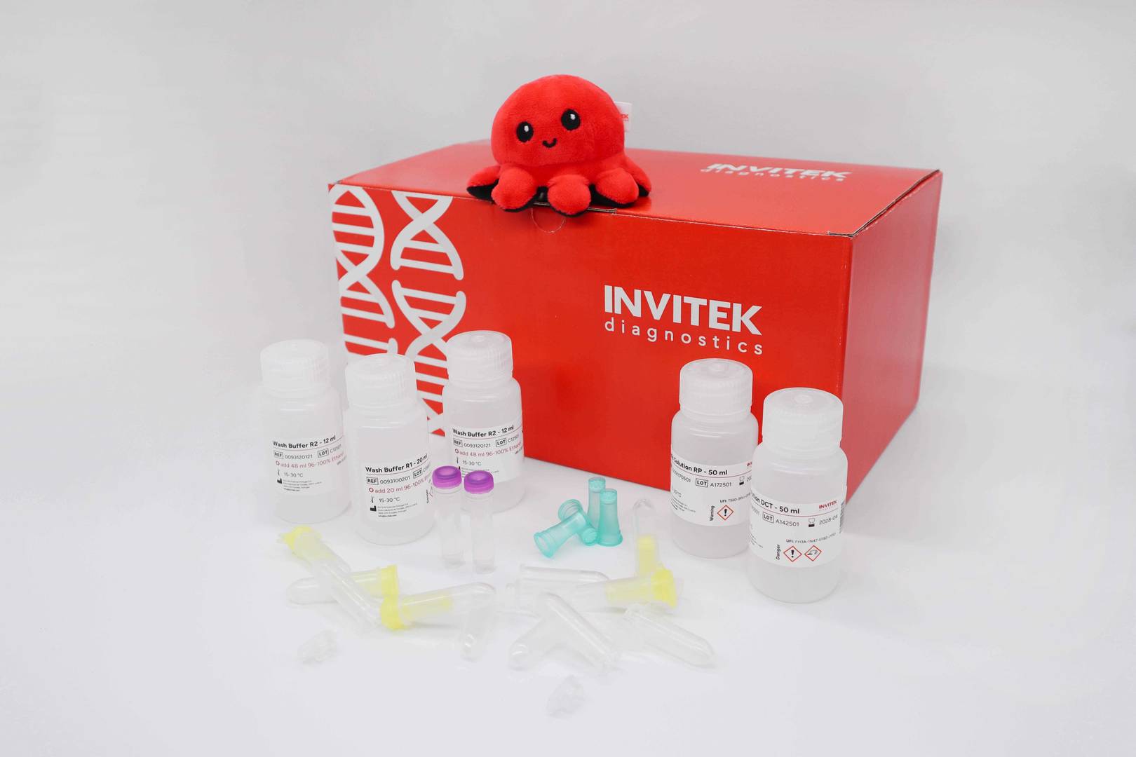 Red Invitek Diagnostics InviTrap Spin Plant RNA Mini Kit box with reagent bottles and yellow spin filters.